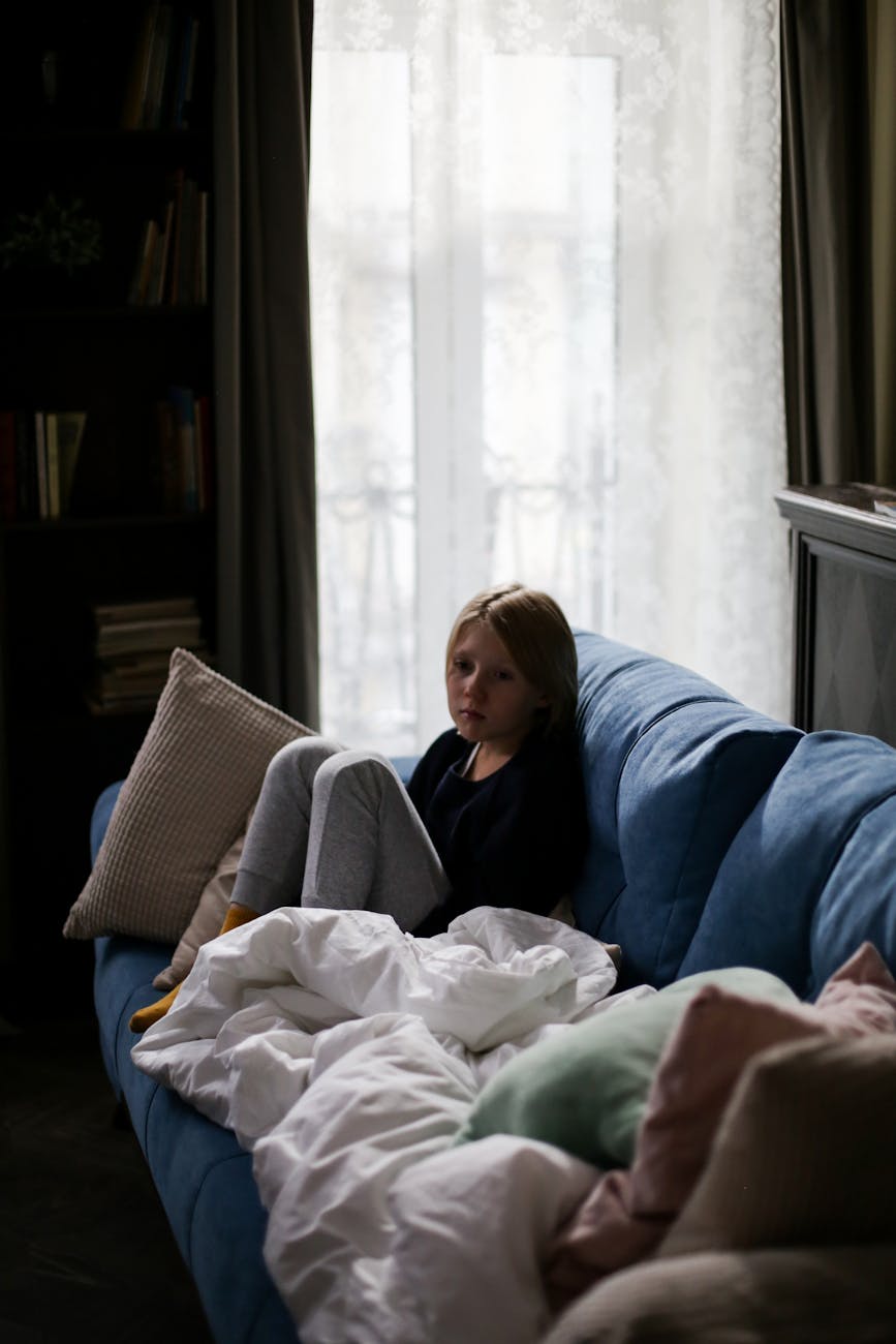 a boy sitting on the couch
