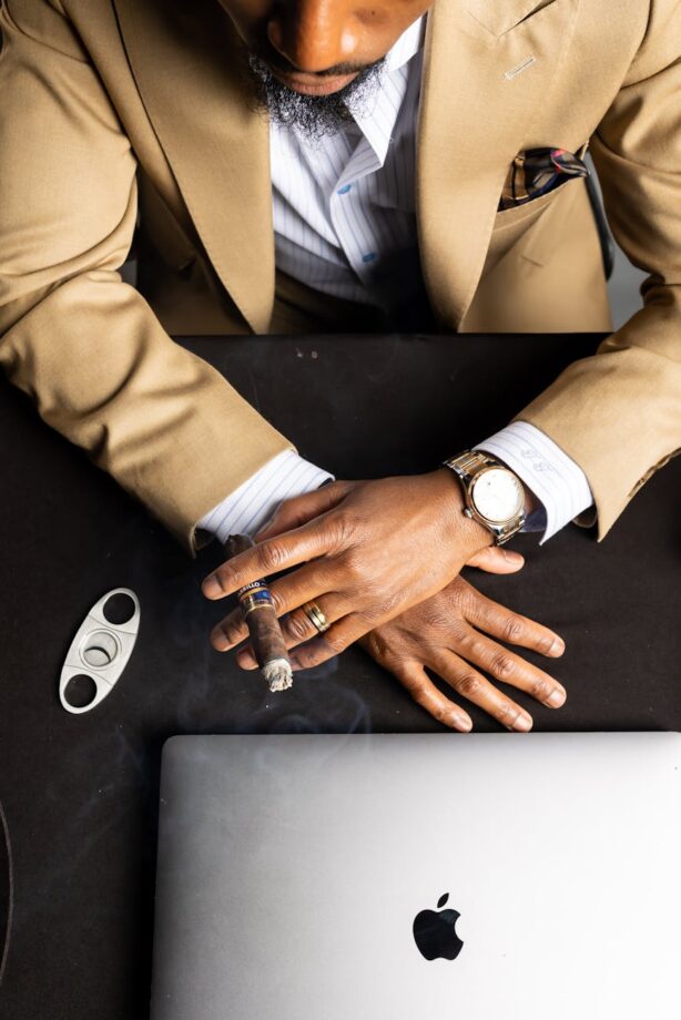 man in suit smoking cigar