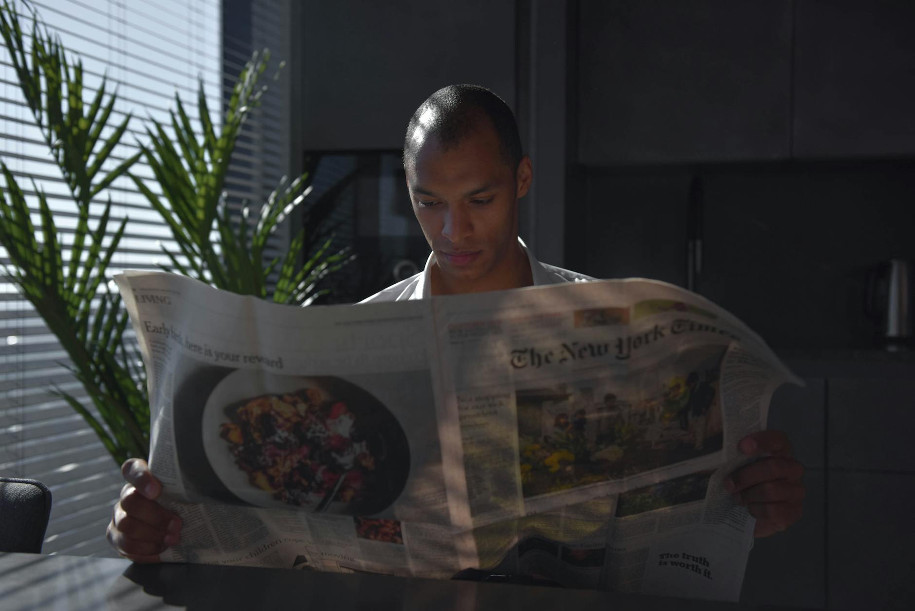 a man reading a newspaper